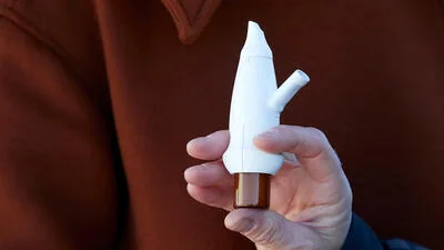 Breath-powered precision nasal drug-delivery device, associated with inventor Per Gisle Djupesland