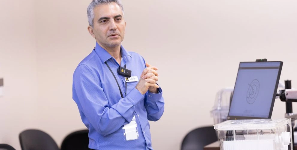 Reza Abdolvand speaking in a University of Central Florida laboratory